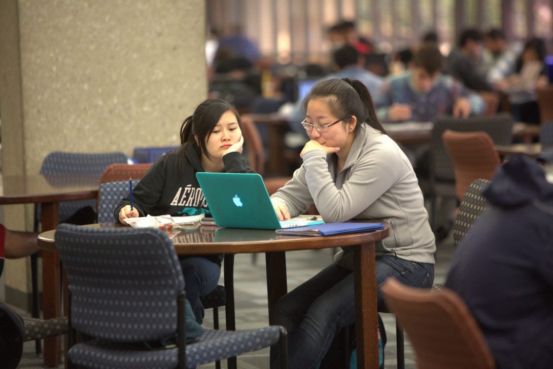 student looking at her laptop