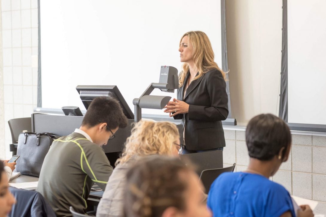 Instructor talking to students