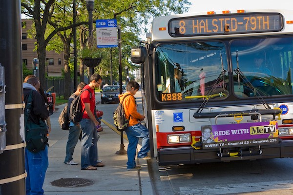 students boarding a city bus