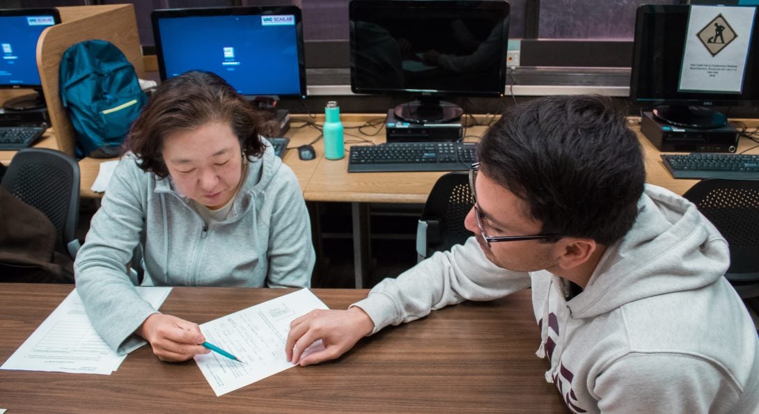 Students reading comments