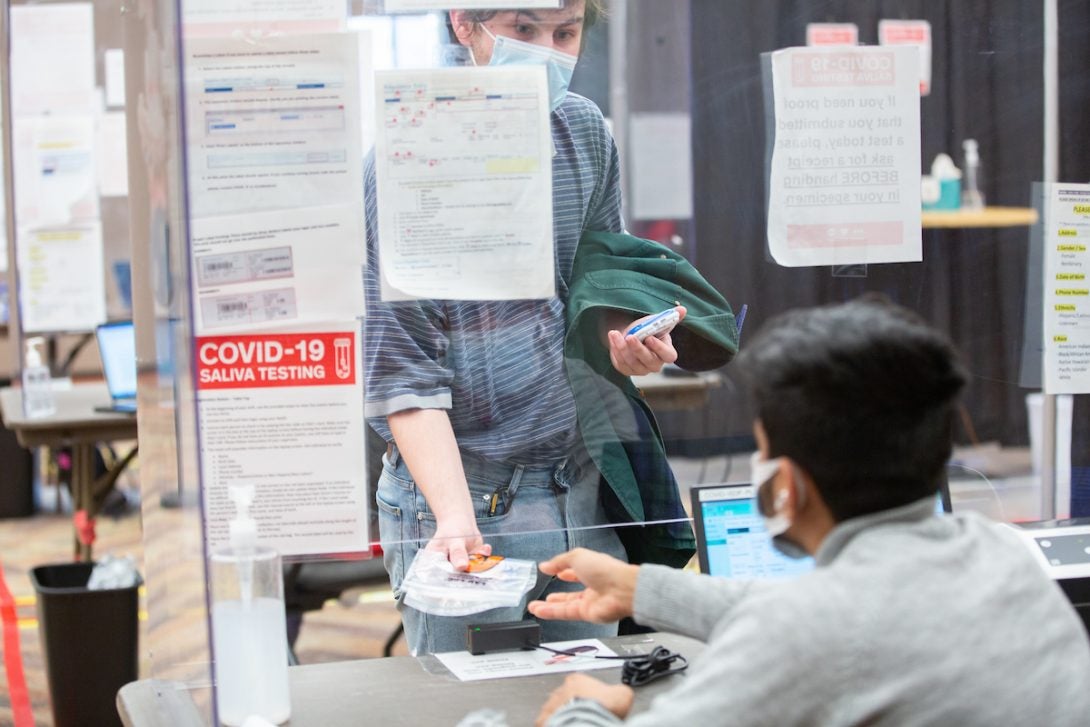 student walking in to get vaccination